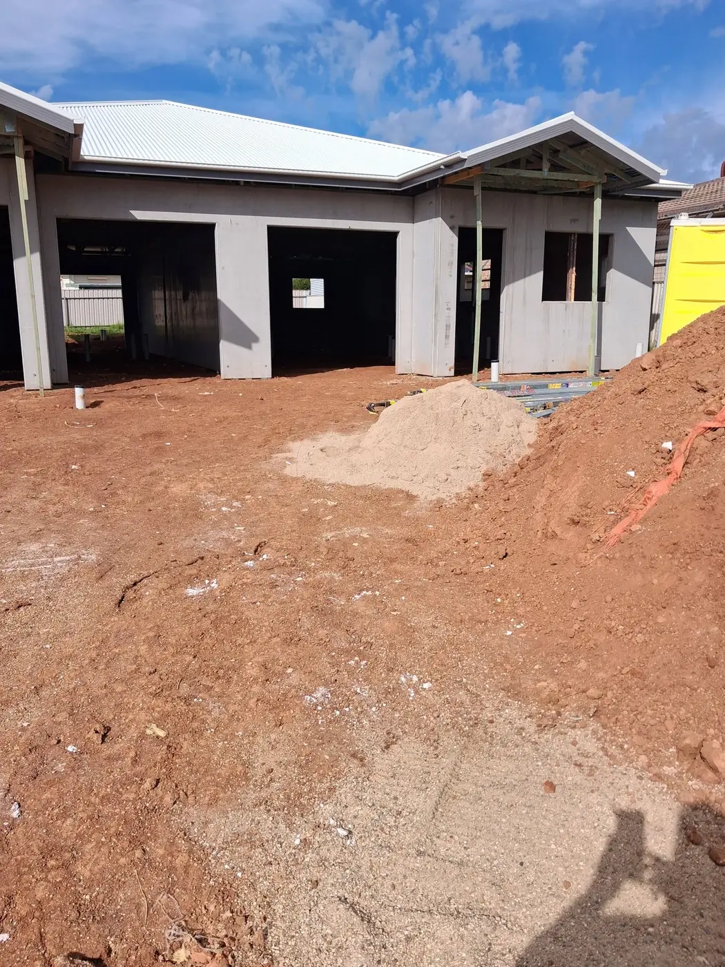 The same construction frontage with the roofing debris removed