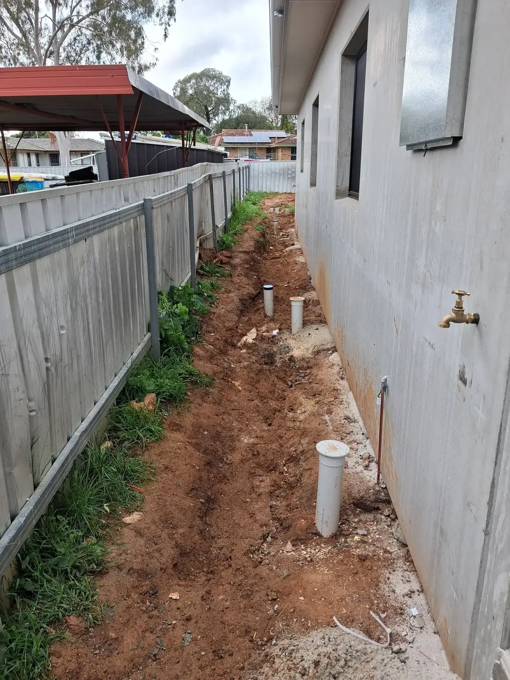 The same alley cleared back to a plain dirt path