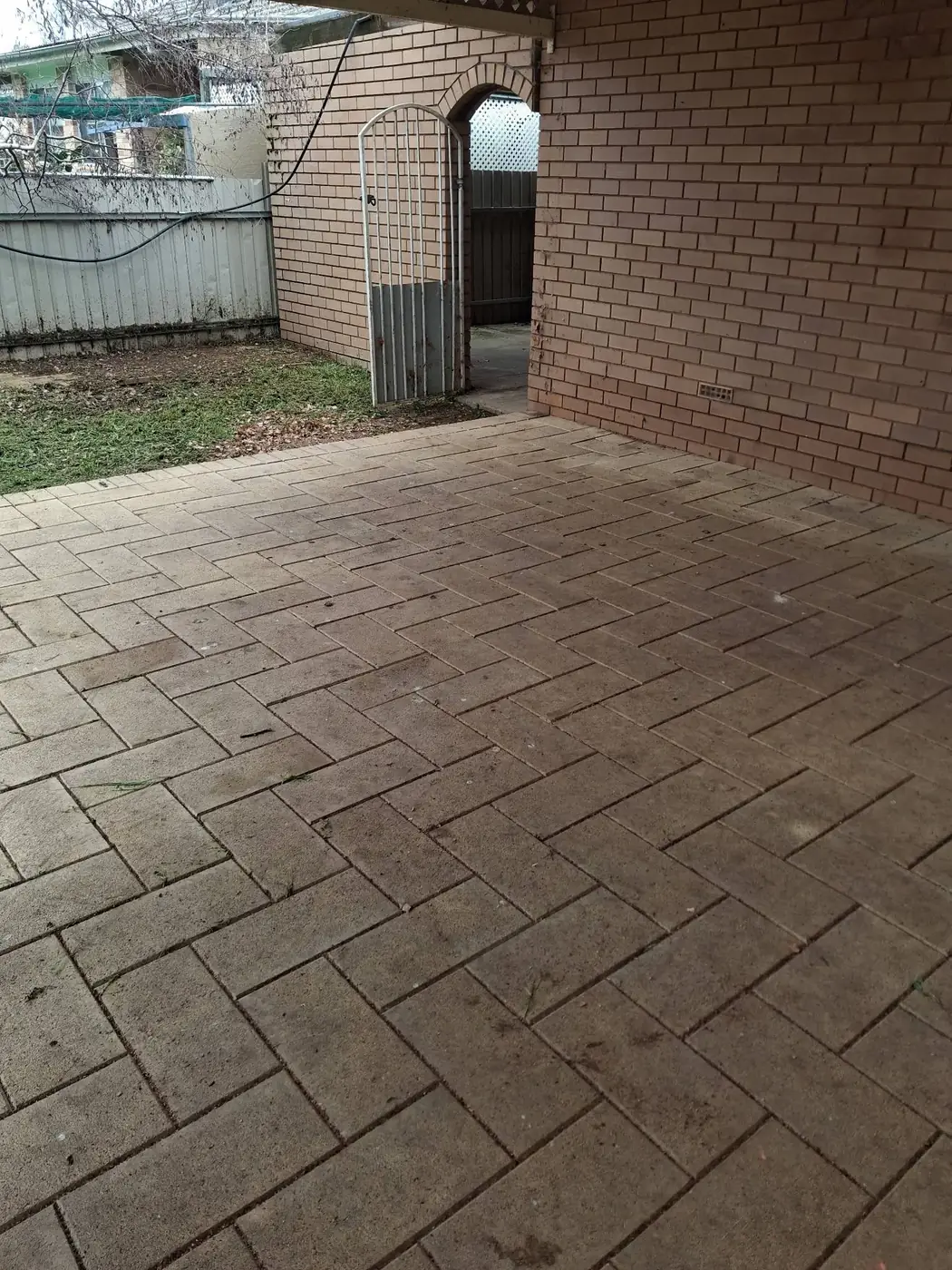 The same courtyard fully cleared, showing the paving underneath